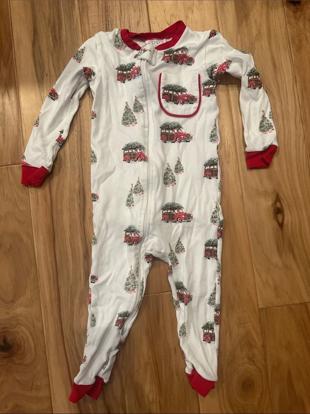 Kids Holiday One-Piece Pajama White with Red Truck Print by Posh Pickle Company